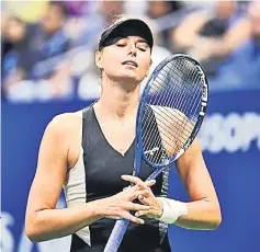  ??  ?? Sharapova reacts after losing a point against Carla Suarez Navarro of Spain in a fourth round match. — USA TODAY Sports