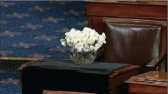  ?? SENATE TELEVISION VIA AP ?? The desk of Sen. John McCain, R-Ariz., is draped in black on the floor of the U.S. Senate on Monday on Capitol Hill in Washington. McCain died at the age of 81, on after battling brain cancer.