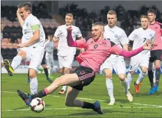  ??  ?? BIG STAGE: Oli McBurnie challenges Estonia’s Marten Kuusk in the U21 friendly on Tuesday night.