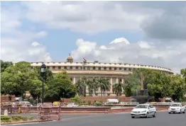  ?? — PTI ?? The tricolour flies at half- mast at Parliament Building during the seven- day state mourning on demise of former President Pranab Mukherjee in New Delhi on Tuesday.