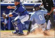  ?? MONICA HERNDON/TAMPA BAY TIMES ?? Mallex Smith of the Rays scores on a Daniel Robertson hit during the fifth inning against the Blue Jays on Thursday. Tampa Bay won 5-3.