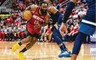  ?? Mark Mulligan / Staff photograph­er ?? James Harden drives past Minnesota Timberwolv­es guard Josh Okogie at Toyota Center during the Rockets’ last game before the pandemic forced the NBA to shut down the season.