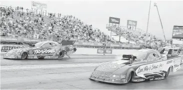  ?? Thomas B. Shea photos ?? Courtney Force, left, got the jump on Tim Wilkerson to win the Funny Car division for her eighth career title but first since 2014.