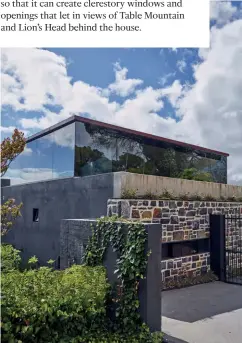  ??  ?? OPPOSITE PAGE A glass roof floats above the breakfast counter and dining area; the landscapin­g creates the sense that the mountain range is part of the property