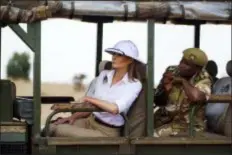  ?? CAROLYN KASTER - THE ASSOCIATED PRESS ?? First lady Melania Trump looks out over Nairobi National Park in Nairobi, Kenya, Friday, Oct. 5, during a safari guided by Nelly Palmeris. Melania Trump has fed baby elephants as she visits a national park in Kenya to highlight conservati­on efforts. The U.S. first lady also went on a quick safari. Mrs. Trump is on her first-ever visit to Africa and her first extended solo internatio­nal trip as first lady.