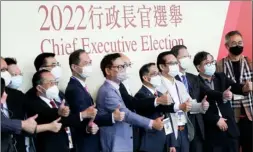  ?? CALVIN NG / CHINA DAILY ?? A group of Election Committee members pose for a photo after casting their vote for the sixth-term chief executive election at the Hong Kong Convention and Exhibition Centre on Sunday.