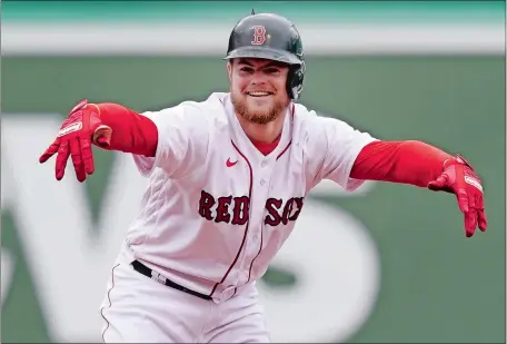  ?? ELISE AMENDOLA/AP PHOTO ?? Christian Arroyo celebrates his RBI double in the fifth inning of Boston’s 9-2 win over the Tampa Bay Rays at Fenway Park on Wednesday.