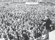  ?? FRED RAMAGE/GETTY IMAGES ?? The American evangelist Rev. Billy Graham addresses the crowd in Trafalgar Square in London.