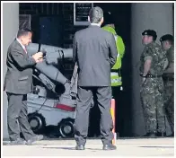  ??  ?? Bomb disposal team and their robot go to work