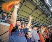  ?? Godofredo A. Vásquez / Staff Photograph­er ?? Jaime Gonzalez, left, and his son James, 11, get loud with the rest of Minute Maid Park on Thursday night.