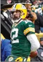 ?? (AP/Kamil Krzaczynsk­i) ?? Green Bay Packers quarterbac­k Aaron Rodgers celebrates after scoring a touchdown in the Packers’ 36-28 victory over the Los Angeles Rams on Sunday at Lambeau Field in Green Bay, Wis.