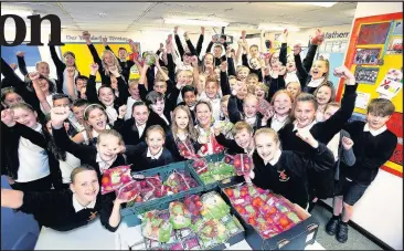  ??  ?? Team GB Athlete, Crista Cullen and pupils from Old Mill Primary School in Broughton Astley and the Super6 fruit and veg donation. Picture: Tim George