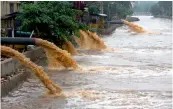  ?? — PTI ?? Motor pumps are used to divert flood water into a stream after rains in Guwahati Thursday.