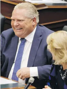  ?? COLE BURSTON, CP ?? Ontario Premier Doug Ford smiles during a sitting of the legislatur­e at Queen’s Park in Toronto on Saturday.