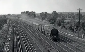  ??  ?? On a very hot Saturday July 27, 1963, Britannia No. 70031 Byron is running very fast near Harrow with the 12.15pm Blackpool to Euston. DON BENN