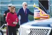  ?? AP PHOTO/MANUEL BALCE CENETA ?? President Joe Biden escorts Rep. Nancy Pelosi, D-Calif., from Marine One to attend a fundraiser Wednesday in San Francisco.