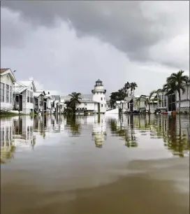  ?? DAVID GOLDMAN / ASSOCIATED PRESS ?? A mobile home community is flooded in the aftermath of Hurricane Irma in Everglades City, Fla., on Monday.