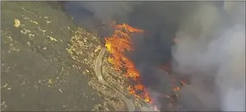  ??  ?? In this Friday still image taken from a video provided by KABC-TV, a wildfire burns in Cleveland National Forest in Wildomar. The fire began early Thursday afternoon in the Wildomar Off-Highway Vehicle Area in the Cleveland National Forest, about 70...