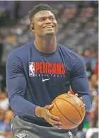  ?? MICHAEL AINSWORTH ASSOCIATED PRESS FILE PHOTO ?? Zion Williamson and the Pelicans are preparing to make a ‘playoff push,’ something that appeared highly unlikely when he was sitting on the sidelines with a surgically repaired knee.