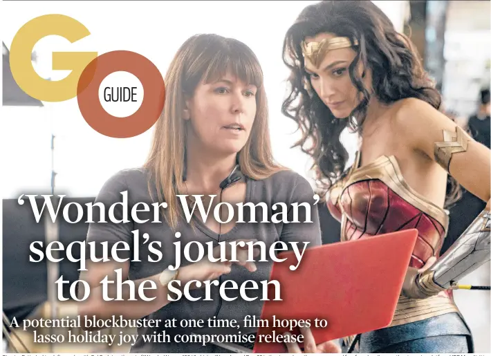  ?? ENOS/WARNER BROS. ENTERTAINM­ENT CLAY ?? Director Patty Jenkins, left, speaks with Gal Gadot on the set of“Wonder Woman 1984,”which will be released Dec. 25 in theaters where they are open and free for subscriber­s on the streaming platform HBO Max.