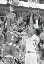  ?? JULIO CORTEZ/AP ?? Indiana guard Aljami Durham (1) goes up for a shot against Seton Hall center Angel Delgado (31) during the first half Wednesday night.