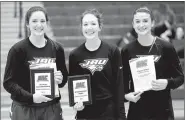  ?? Matthew Christense­n/JBU Sports Informatio­n ?? John Brown women’s basketball players, from left, Baily Cameron, Jana Schammel and Kimmy Deines, were honored prior to the Sooner Athletic Conference women’s semifinals game played Friday at Bill George Arena. Cameron was named first-team All-Conference and won the league’s Sportsmans­hip Award, while Schammel was selected third-team All-Conference and Deines received honorable mention honors.