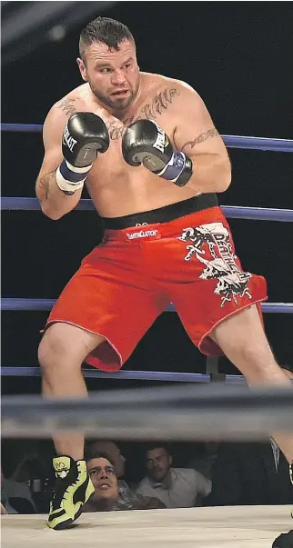  ?? PHOTOS: ED KAISER ?? ABOVE: Tim Hague looks top defend himself during his ill-fated match with Adam Braidwood in the KO 79 boxing event in Edmonton on June 16. LEFT: A photo displayed at the celebratio­n of life for Hague.
