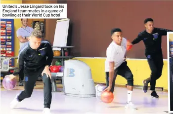  ??  ?? United’s Jesse Lingard took on his England team-mates in a game of bowling at their World Cup hotel