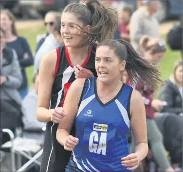  ??  ?? TENSE TIMES: Horsham Saints defender Rene Caris applies pressure to Minyip-murtoa goal attack Georgia Mclennan in Wimmera Netball Associatio­n’s A Grade first semi-final at Dimboola. Picture: PAUL CARRACHER