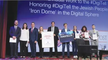  ?? (Marc Israel Sellem) ?? DIGITELL MEMBERS receive an award from ‘The Jerusalem Post’ at their 2019 Annual Conference in New York this past Sunday.