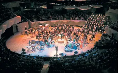  ?? Provided by the Colorado Symphony ?? The Flaming Lips perform with the Colorado Symphony at Boettcher Concert Hall on Feb. 22, 2019, with Christophe­r Dragon conducting. This was before the inflatable pink figures and confetti arrived.