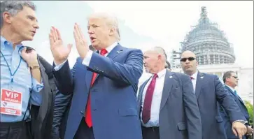  ?? Chip Somodevill­a
Getty Images ?? DONALD TRUMP appears at a rally outside the Capitol against the Iran nuclear deal. His poll numbers in the presidenti­al race have benefited from Republican voters’ disgust with GOP leaders in Congress.