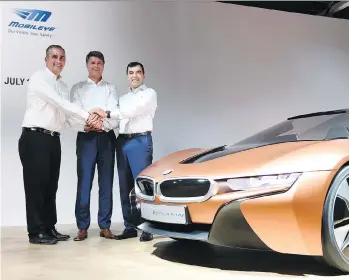  ?? CHRISTOF STACHE/AFP/GETTY IMAGES ?? From left to right, Intel CEO Brian Krzanich, BMW CEO Harald Krueger, and Amnon Shashua, Mobileye co-founder and chairman, are collaborat­ing on the fully autonomous BMW iNEXT, which they plan to debut in 2021. Mobileye’s Ziv Aviram will address the YPO...