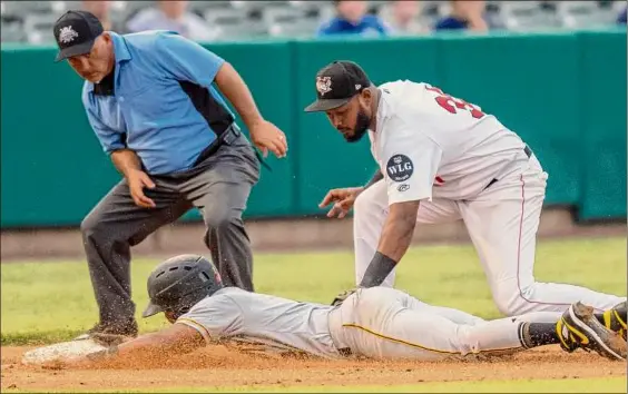  ?? Photos by James Franco / Special to the Times Union ?? Valleycats third basemen Juan Silverio puts a tag on Sussex County baserunner Nilo Rijo at Joseph L. Bruno Stadium in Troy on Saturday night. Tri-city fell to a 4-16 season record after being defeated by the Miners 8-5 in a game that was interrupte­d by a brief rain delay.