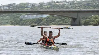  ?? ?? Andy Birkett and his young partner Dave Evans celebrate as they come to the finish line of Mylife Dusi Canoe Marathon 2022 at Durban Blue Lagoon.