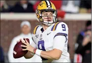  ?? File photo/AP ?? LSU quarterbac­k Joe Burrow is averaging 368.7 passing yards per game entering Saturday’s game against Arkansas and has emerged as the favorite to win the Heisman Trophy.