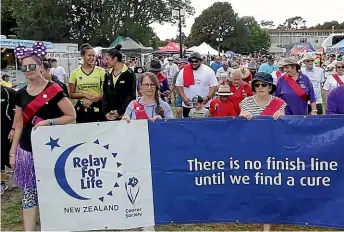  ?? WARWICK SMITH/STUFF ?? The survivors’ lap at the Manawatu¯ Relay for Life spells out the challenge.