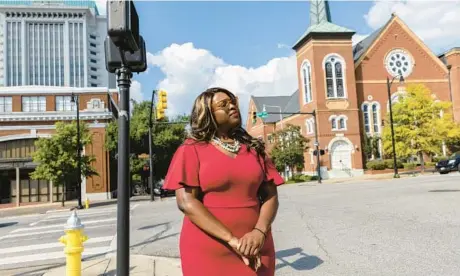  ?? VASHA HUNT/AP 2022 ?? Khadidah Stone stands between her old congressio­nal District 7, to her right, and her new district, District 2, to her left, in Montgomery, Ala.