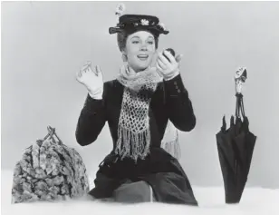  ?? DISNEY ?? Julie Andrews made her feature film debut in the 1964 musical “Mary Poppins.” The carpet bag, left, is an item seen in Disney Plus’ new docuseries “Prop Culture.”