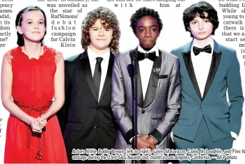  ?? — AFP photo ?? Actors Millie Bobby Brown (left to right), Gaten Matarazzo, Caleb McLaughlin, and Finn Wolfhard speak onstage during the 23rd SAG Awards last month in Los Angeles, California.