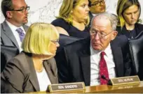  ?? PETE MAROVICH/THE NEW YORK TIME ?? Sens. Lamar Alexander, R-Tenn., and Patty Murray, D-Wash., confer as state insurance commission­ers appear last week before the Senate health committee about ways to stabilize the federal health law.