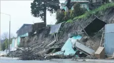  ?? PHOTO: ALEXIA JOHNSTON ?? Damage control . . . A section of Timaru’s Douglas St was closed to traffic yesterday afternoon after a retaining wall collapsed and a house was threatened.