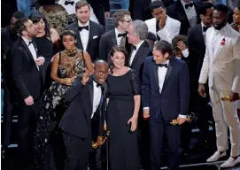  ?? — AP ?? Director Barry Jenkins and the cast of Moonlight the Oscars ceremony in Los Angeles on Sunday. accept the award for best picture at