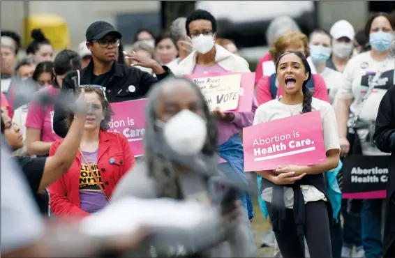  ?? (AP/Steve Ruark) ?? Chandler Jones (right), 26, participat­es May 14 in an abortion rights rally in Baltimore.