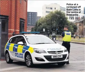  ??  ?? Police at a cordoned-off Bath Lane in the centre of Newcastle