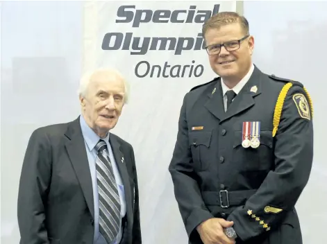  ?? HARLEY DAVIDSON/SPECIAL TO POSTMEDIA NETWORK ?? Dr. Frank Hayden, founder of the Special Olympics, and Niagara Regional Police Acting Deputy Chief Mark McMullen stand together after the NRP presented Hayden with an honorary chief of police status.