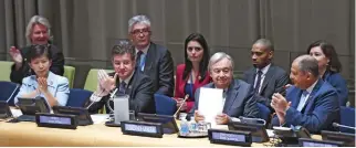  ??  ?? United Nations Secretary-General António Guterres, second right, is applauded after opening the Signing Ceremony for the Treaty on the Prohibitio­n of Nuclear Weapons in New York on Wednesday. (AFP)