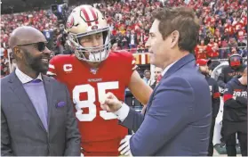  ?? Michael Zagaris / Getty Images ?? Former 49ers QB Steve Young (right) talks with George Kittle (center) and Jerry Rice prior to San Francisco’s win over Green Bay on Jan. 19. Young spoke to the players in December about the need to cherish their run while it lasts.