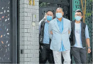  ?? /Reuters ?? Laying down the law: Media mogul Jimmy Lai, seen here being detained by national security in Hong Kong, has been accused of being an ‘anti-China troublemak­er’.