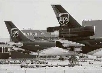  ?? Associated Press file photo ?? An e-commerce boom during the pandemic is spurring demand for diesel to power ships, trucks, planes and freight trains. UPS said it observed a seasonal peak almost without parallel.